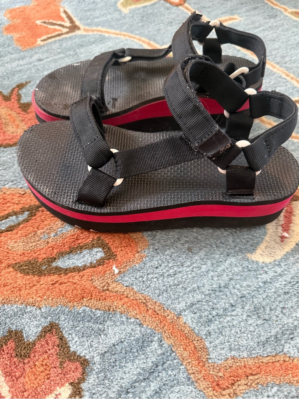Teva’s Black Strappy Platform Sandals with Red Accent